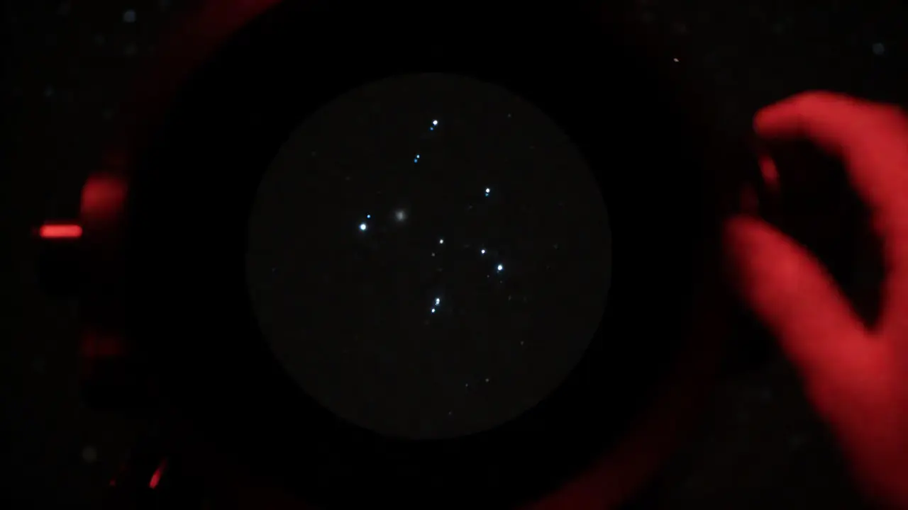 View through finder scope showing star triangle and nebula